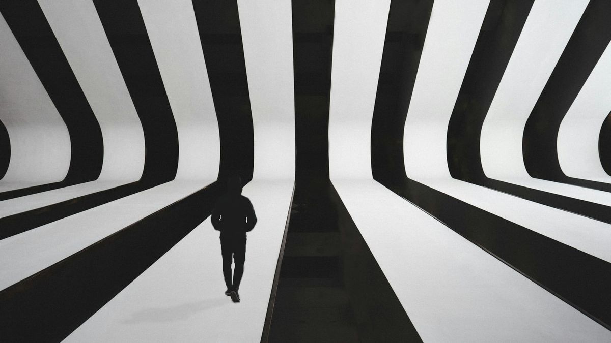 Blackand white forms intersecting and diverging, suggesting structural systems shaping individual paths.