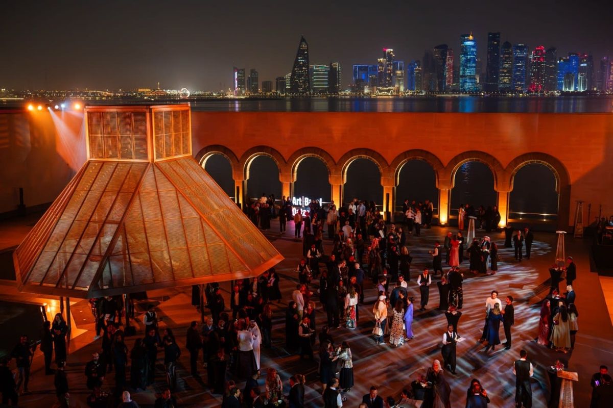 Visitors walking between M7 and the Doha Design District during Art Basel Qatar 2026 VIP days.