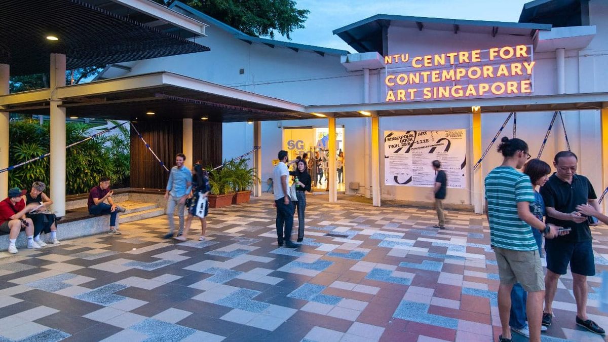 Main view of the Singapore Art Book Fair, with visitors and exhibitors gathered around the venue.