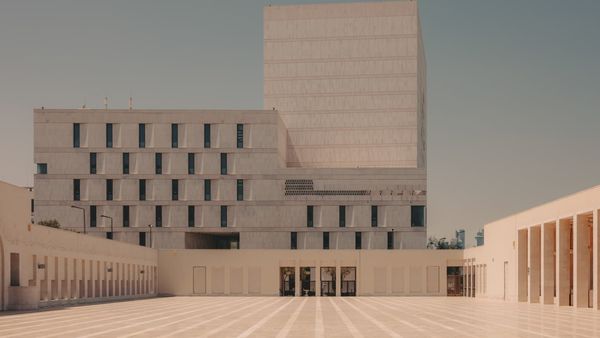Modern cultural building in Msheireb Downtown Doha, featuring geometric stone facades and open public walkways.