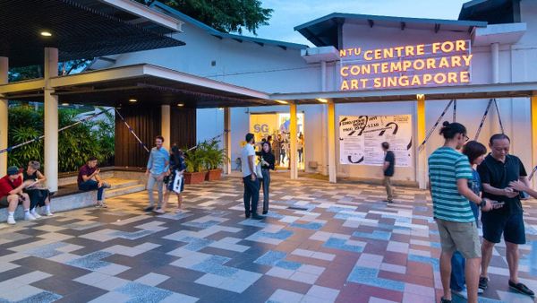 Main view of the Singapore Art Book Fair, with visitors and exhibitors gathered around the venue.