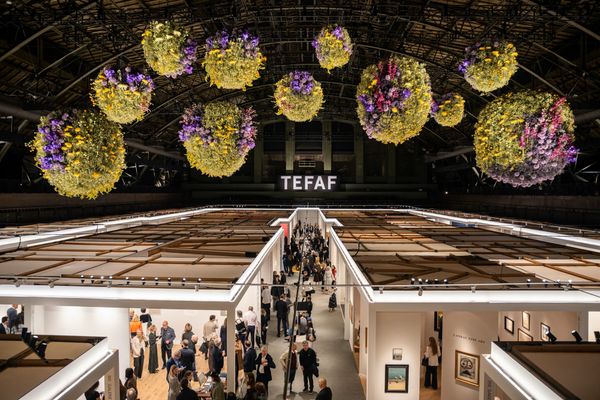 Visitors move through TEFAF New York 2026 inside the Park Avenue Armory, with gallery stands, historic architecture, and cross-category presentations of art, design, jewelry, and antiquities.