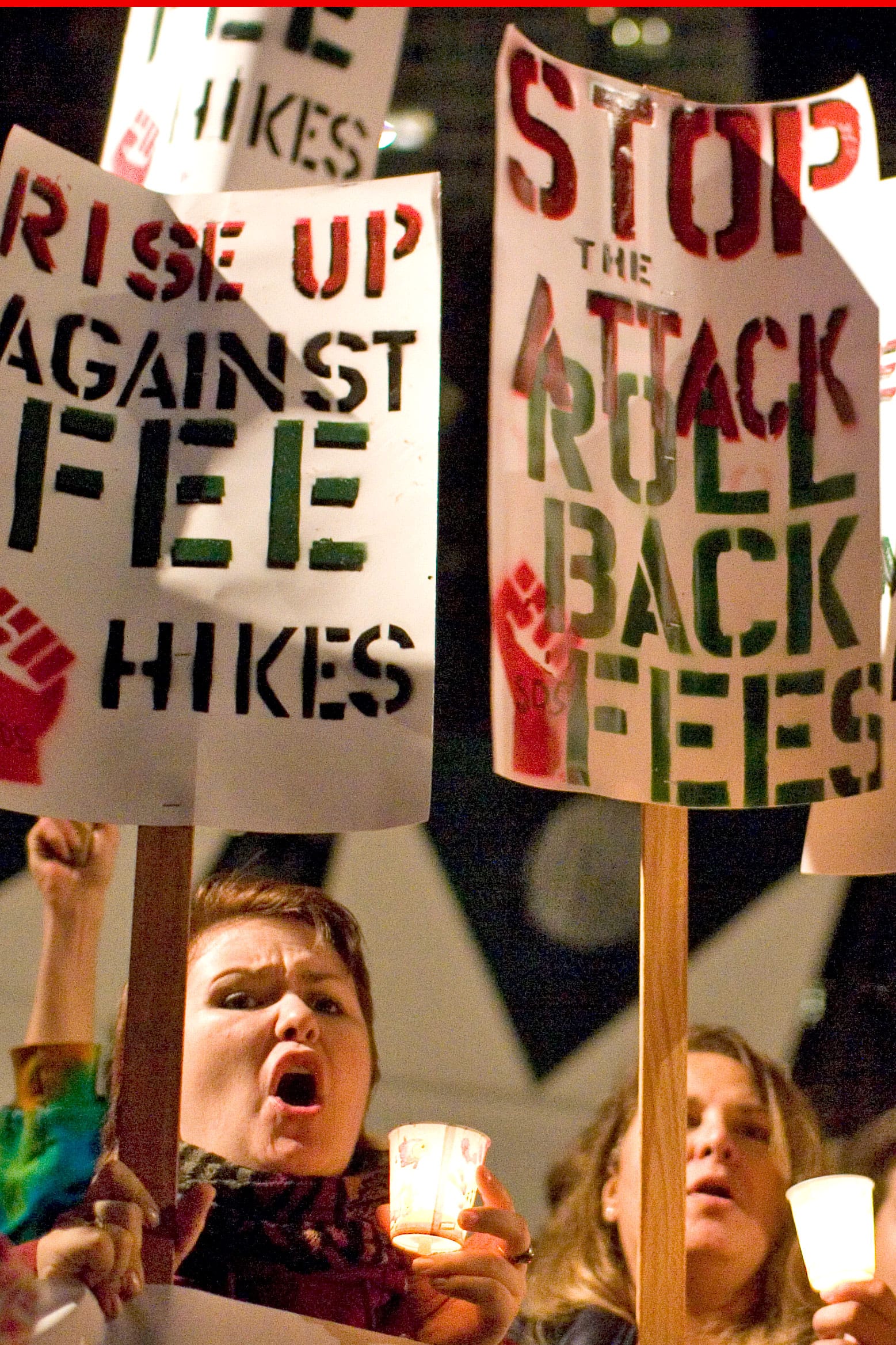 The well-attended gathering brought together representatives from a number of schools, including City College of San Francisco and San Francisco State University. These women hold signs at the end of the march's destination, Yerba Buena Gardens on Nov. 13. 