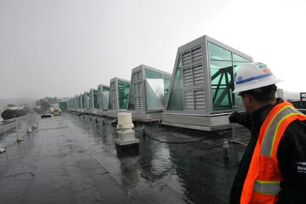 Project Engineer Nick Rossi explains the Lead certified roofs which will be the future home for rooftop gardens that will display native plants. ROBERT ROMANO / THE GUARDSMAN