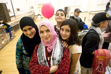 Gaza Remebrance_dsc_0411_web Palestinian refugee and poet Mariam El Shafei (center) stands with her host family (L-R) Halima Shuman, Mouté Shuman and Rasmia Shuman at the Gaza Massacre Commemoration Feb. 6 at the Burlingame Recreation Center. ROBERT ROMANO / THE GUARDSMAN