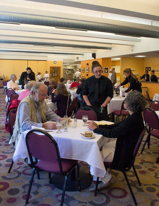 Student Rachel Maestras takes the lunch order of John Carlos, left, and Lidia Szajko, right,  at Pierre Coste Room on Ocean campus, 50 Phelan Avenue, on Tuesday, September 24, 2013. “It is fun, this is the kind of things you want to do, you learn a lot,” Maestras says referring to the Restaurant Operations class. Photo by Lavinia Pisani/The Guardsman