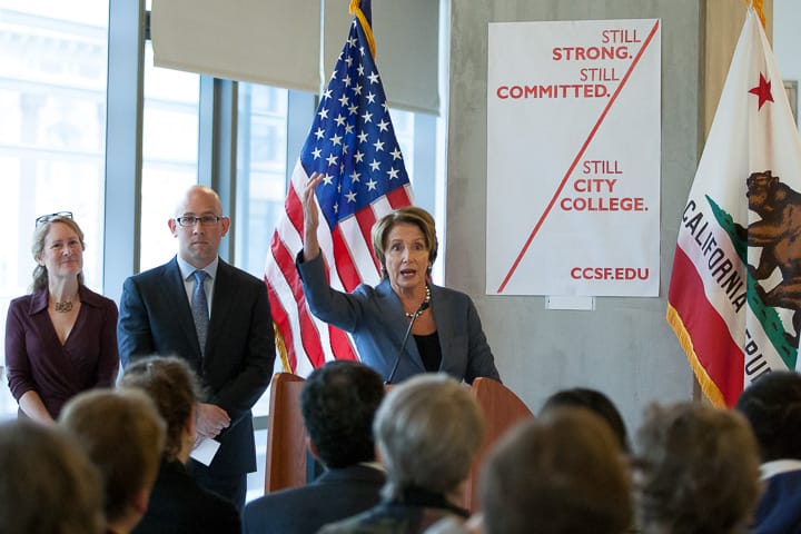 Friends of City College Co-Founder Tracy Wheeler and City College Board of Trustees member Rafael Mandelman stand as House Minority Leader Nancy Pelosi speaks to over one hundred guests during a press conference Jan. 6, 2014, on Chinatown/North Beach center. Photo by Santiago Mejia/The Guardsman 