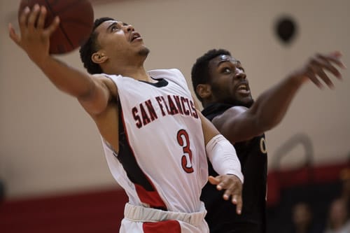 San Francisco Rams sophomore guard Dulani Robinson (3) lays the ball up against the Ohlone College Renegades in a CCCAA men’s basketball game on Ocean campus, Friday, Feb. 22, 2014. The Rams won the game 71-63, finishing the regular season 12-0 undefeated. They won the Coast-North Conference title and will compete in playoffs next week. Photo by Santiago Mejia/The Guardsman