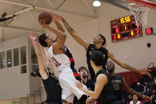 San Francisco Rams sophomore guard Joshua Fox (21) shot is blocked by the Ohlone College Renegades in a CCCAA men’s basketball game on Ocean campus, Friday, Feb. 22, 2014. The Rams won the game 71-63, finishing the regular season 12-0 undefeated. They won the Coast-North Conference title and will compete in playoffs next week. Photo by Santiago Mejia/The Guardsman