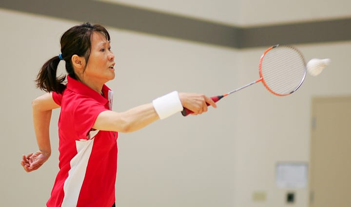 Rams Eva Chau (rank 5) returns the birdie to Skyline. Li and Chau won the match with two 21-15 sets at Ocean campus, Tuesday, March 25, 2014. Photo by Jackson Ly/The Guardsman