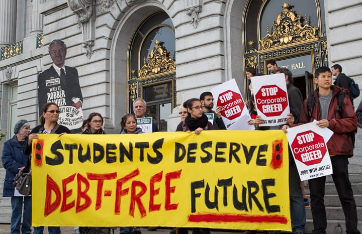 Protesters in front of City Hall on Thursday, March 12, 2014, demanded Wells Fargo’s CEO to modify the companies student loan programs. Photo by Elisa Parrino/The Guardsman