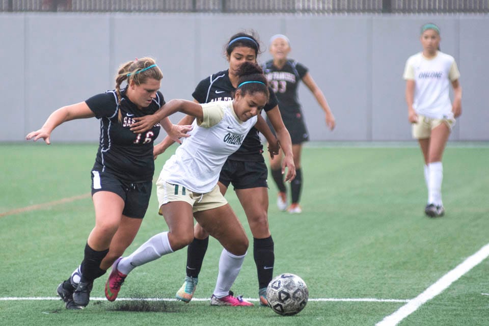 Hannah Mikles #16 and Brenda Flores #28, regain possession of the ball from Ohlone College on Nov. 7 at City College. (Photo by Niko Plagakis)