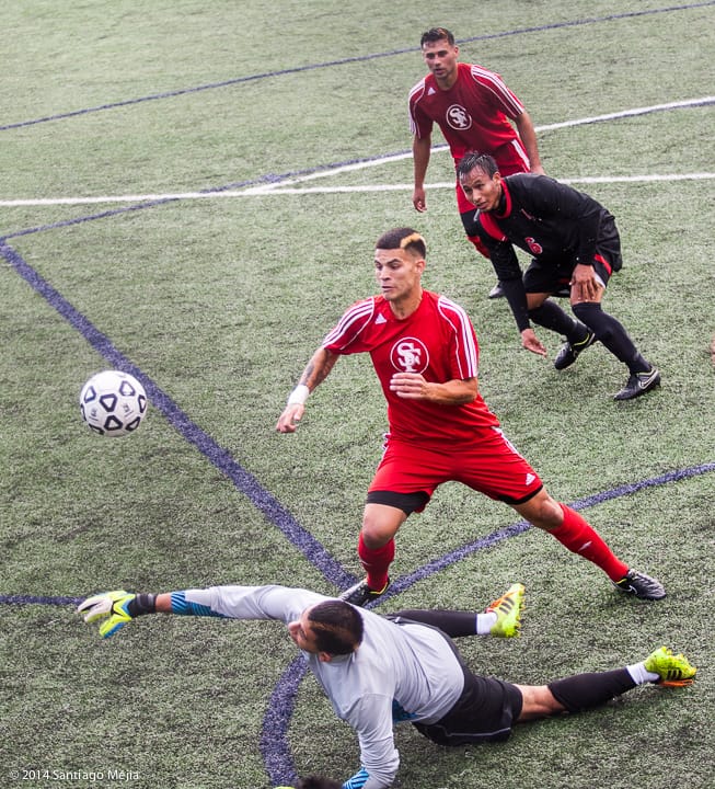 Vasquez dribbles past the goalkeeper. 