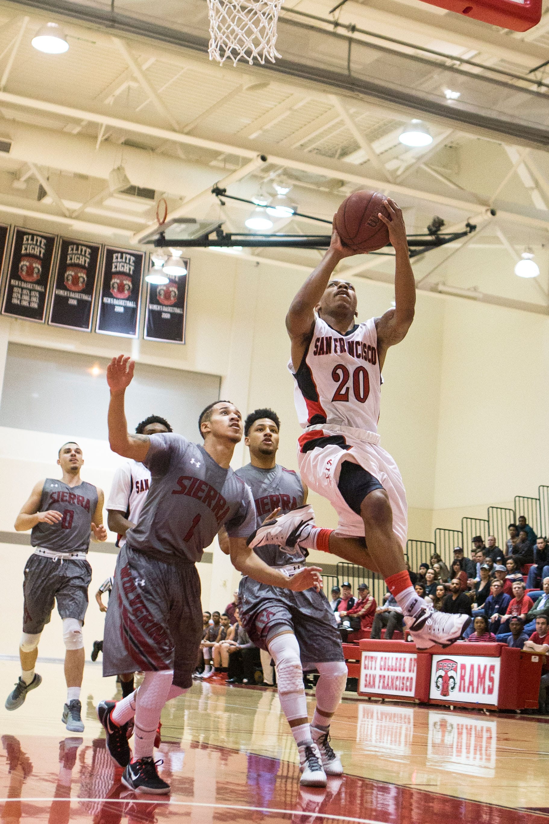 Sophomore point guard Vincent Golson (20) drives to the basket during the first round playoff overtime victory against Sierra College at Brad Duggan Court on Ocean Campus, Saturday, Feb. 28. (Photo by Nathaniel Y. Downes)