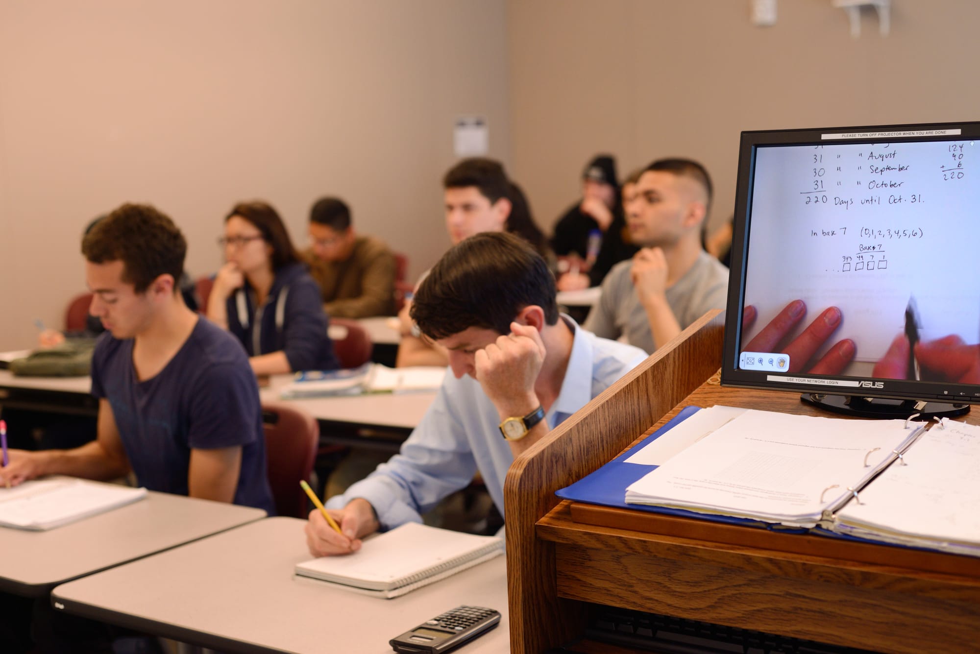 Math professor Keron Keys goes over Chapter 7 using a smart projector with her classroom on Wednesday, March 25 during Math 070 lecture at the Multi-Use Building on Ocean Campus. (Photo by Yesica Prado) 
