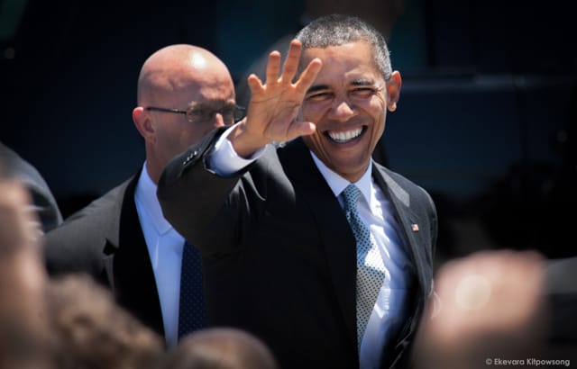 President Barack Obama waves to well-wishers before leaving San Francisco International Airport to the U.S. conference of mayors on Friday, June 19, 2015.