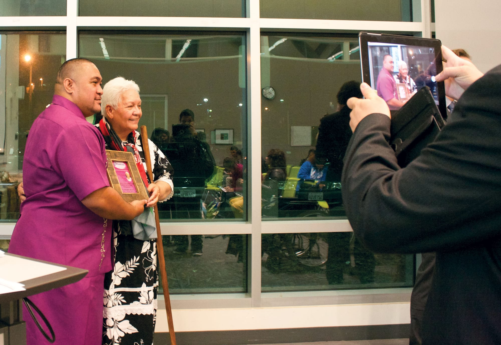 Professor David Palaita(left) and Tahitian guest speaker Flora Aurima- Devatine(right) shared a photo together after she offered Palaita her book of poetry as a gift Sept 29. (Photo by Cassie Ordonio/The Guardsman)