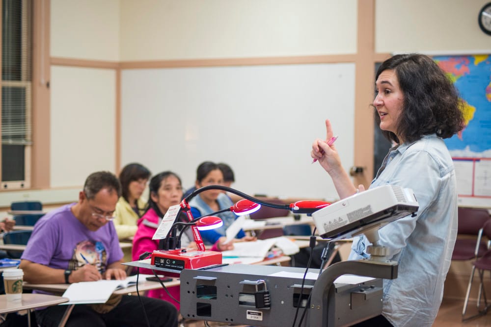 Professor Patricia Gallagher explains the warm up exercise of the day to her beginning ESL class on Wednesday, Oct. 28, 2015 at the City College John Adams Campus. (Photo by Yesica Prado/The Guardsman)