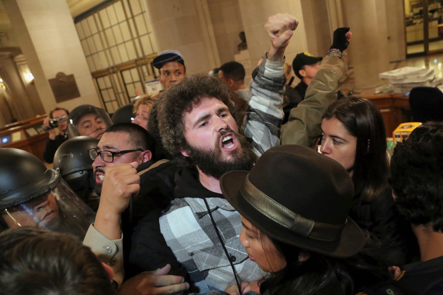 A protester is arrested during a Hunger for Justice SF occupation of City Hall last night. 33 people were arrested. Protesters demanded action against police brutality and for SFPD Chief Suhr to be fired. (Photo by Gabriella Angotti-Jones).