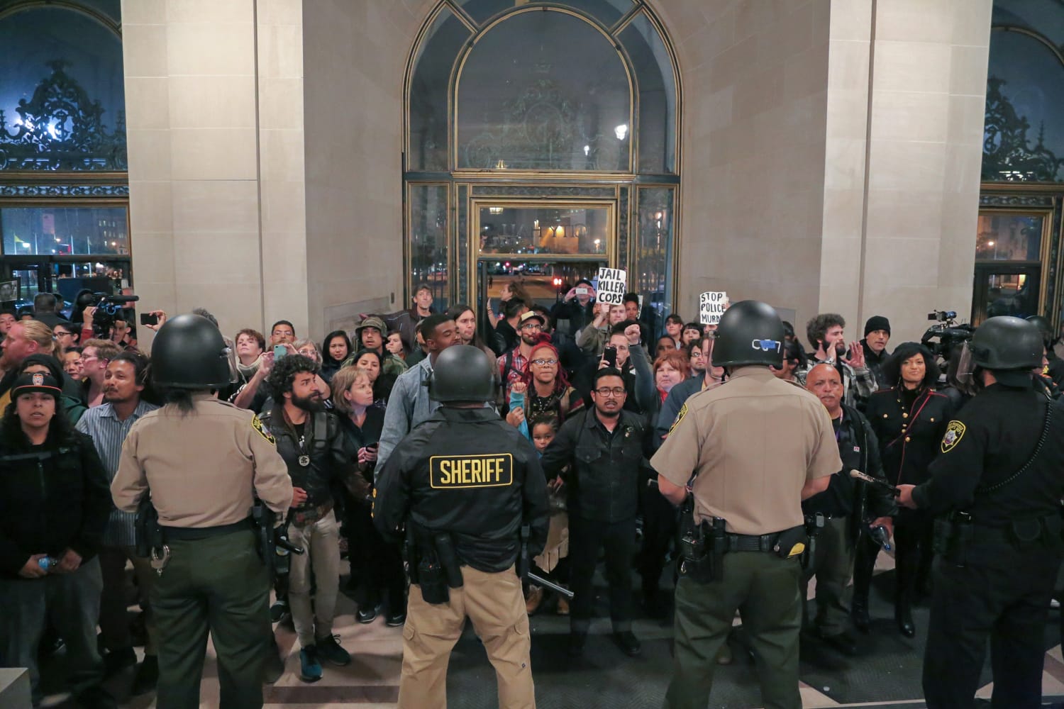 A protester is arrested during a Hunger for Justice SF occupation of City Hall last night. 33 people were arrested. Protesters demanded action against police brutality and for SFPD Chief Suhr to be fired. (Photo by Gabriella Angotti-Jones).