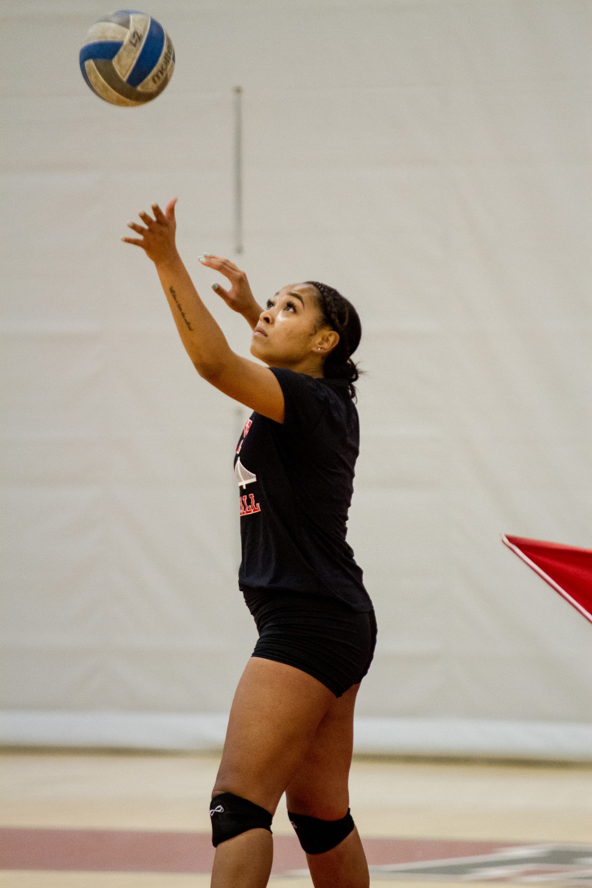 Sophmore Kijana Best, Outside Hitter serving during a practice at the Wellness Center August 19, 2016. Franchon Smith/The Guardsman