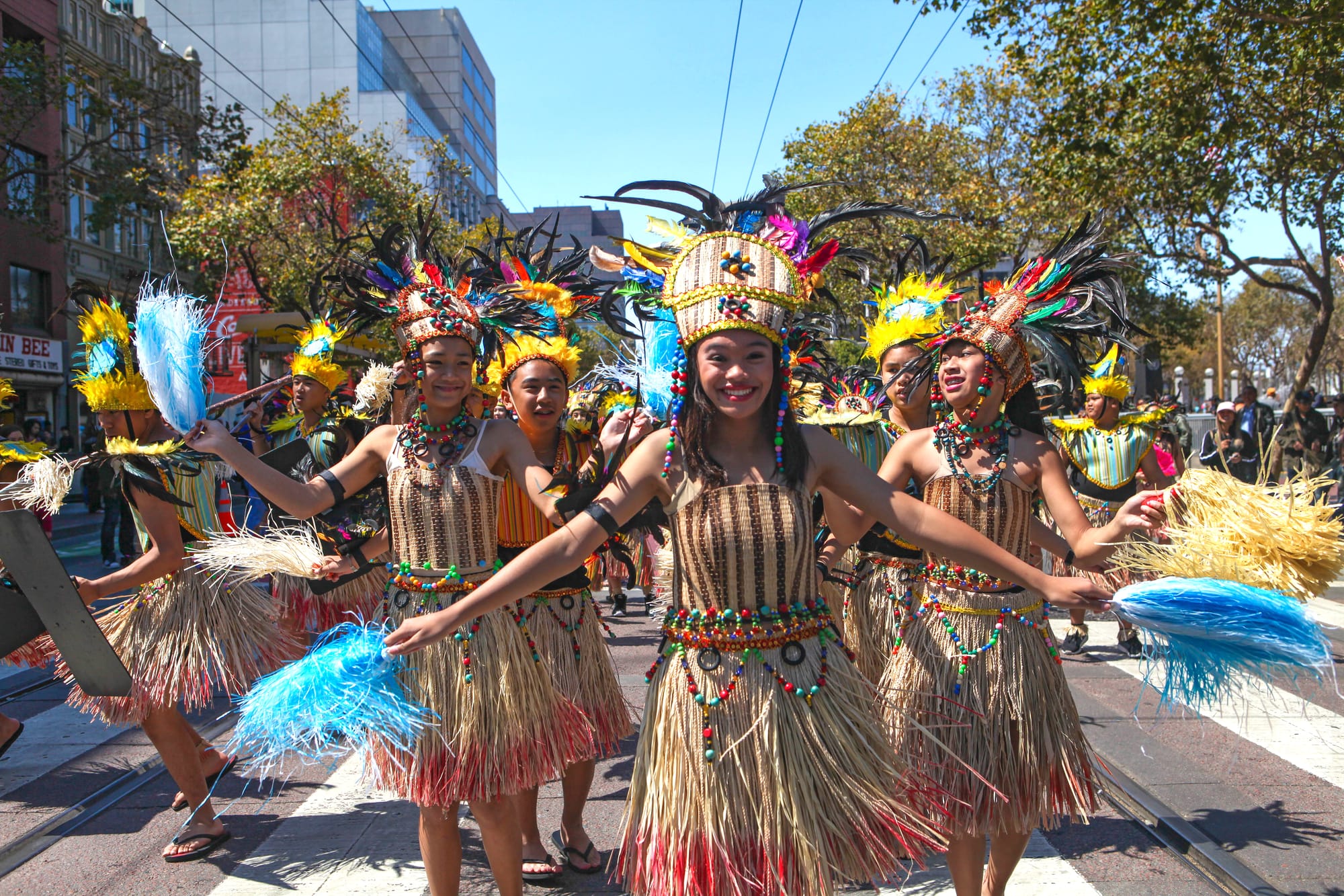 A group of young women and men dance together in the Pistahan Parade down San Francisco's Market Street (Photo by Cassie Ordonio/The Guardsman)