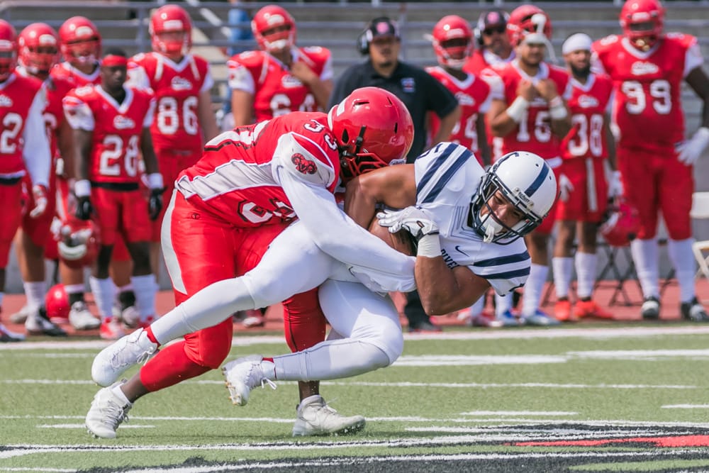 Linebacker Anthony Porter (Number 33) slams into opponent. Photo taken on Sept. 16, 2017 by Peter Wong. 