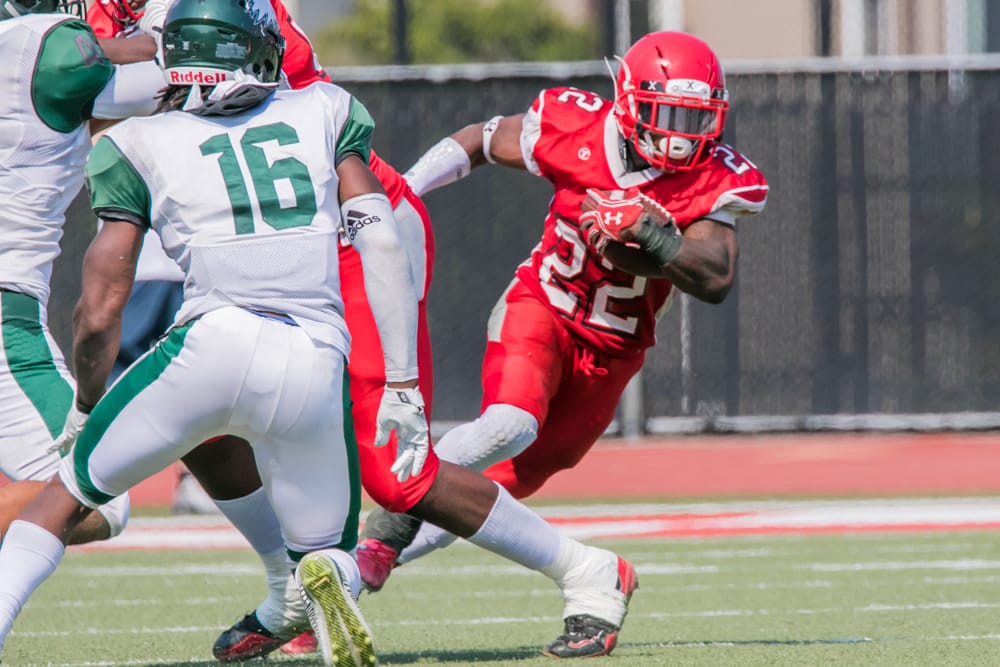Running back Isaiah Floyd (number 22) jukes his way thru Laney defenders. Photo by Peter Wong. 