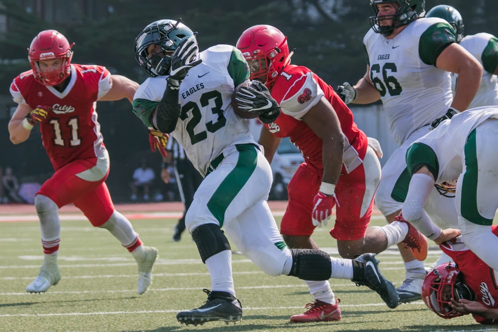 Safety Joey Banks, in his first game back after missing last season with an injury, goes in for the the tackle. Photo by Peter Wong. 