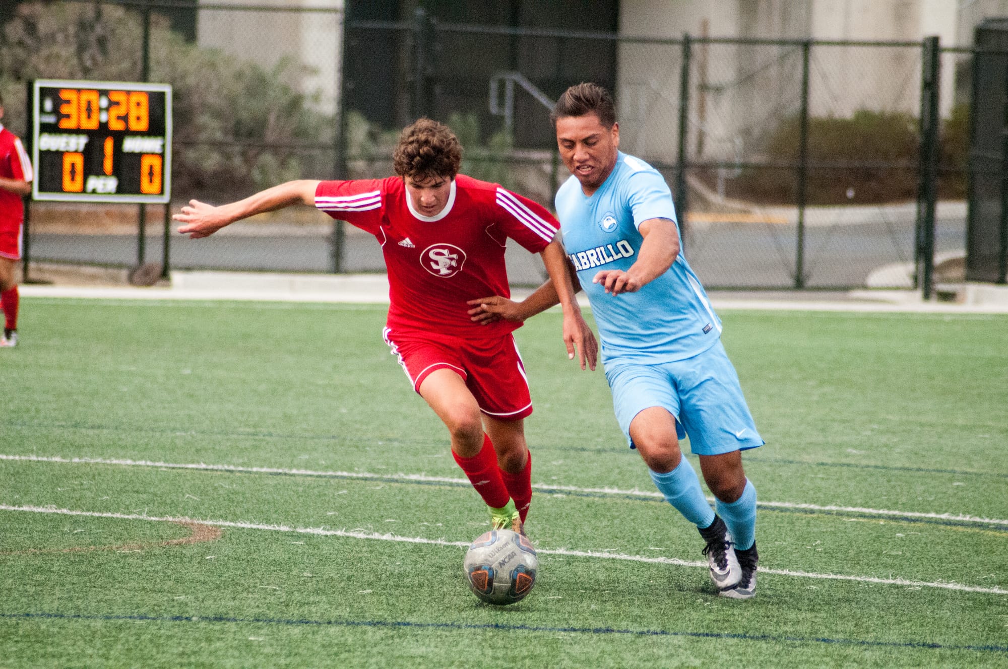 Freshman defense player Austin Rameriz (L) fights for control of the ball during the make up game against Cabrillo College on October 17, 2017 at the Ocean Campus soccer field. Photo by Franchon Smith. Special to The Guardsman.
