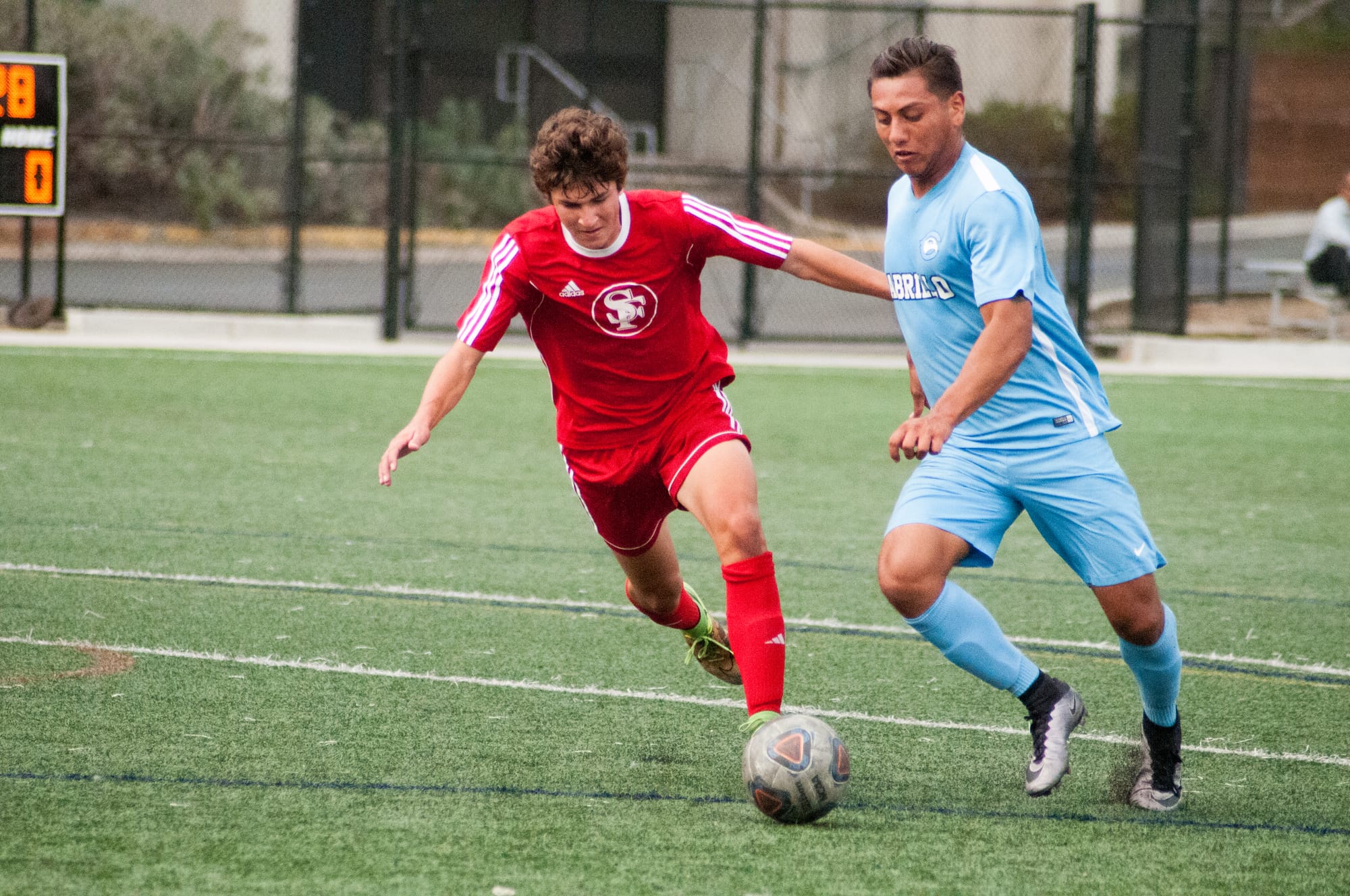 Freshman defense player Austin Rameriz (L) fights for control of the ball during the make up game against Cabrillo College on October 17, 2017 at the Ocean Campus soccer field. Photo by Franchon Smith Special to The Guardsman