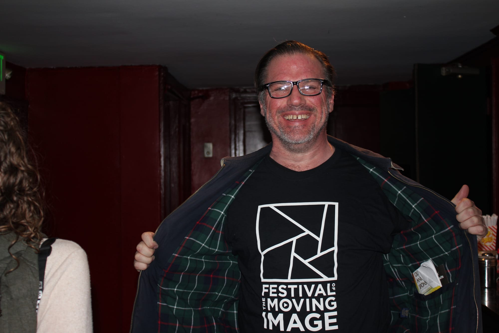 City College student Ross Hayduk embraced the moment while volunteering at the 2016 FMI film festival at the Roxie theater. Photo by professor Misha Antonich/CCSF BEMA department. 
