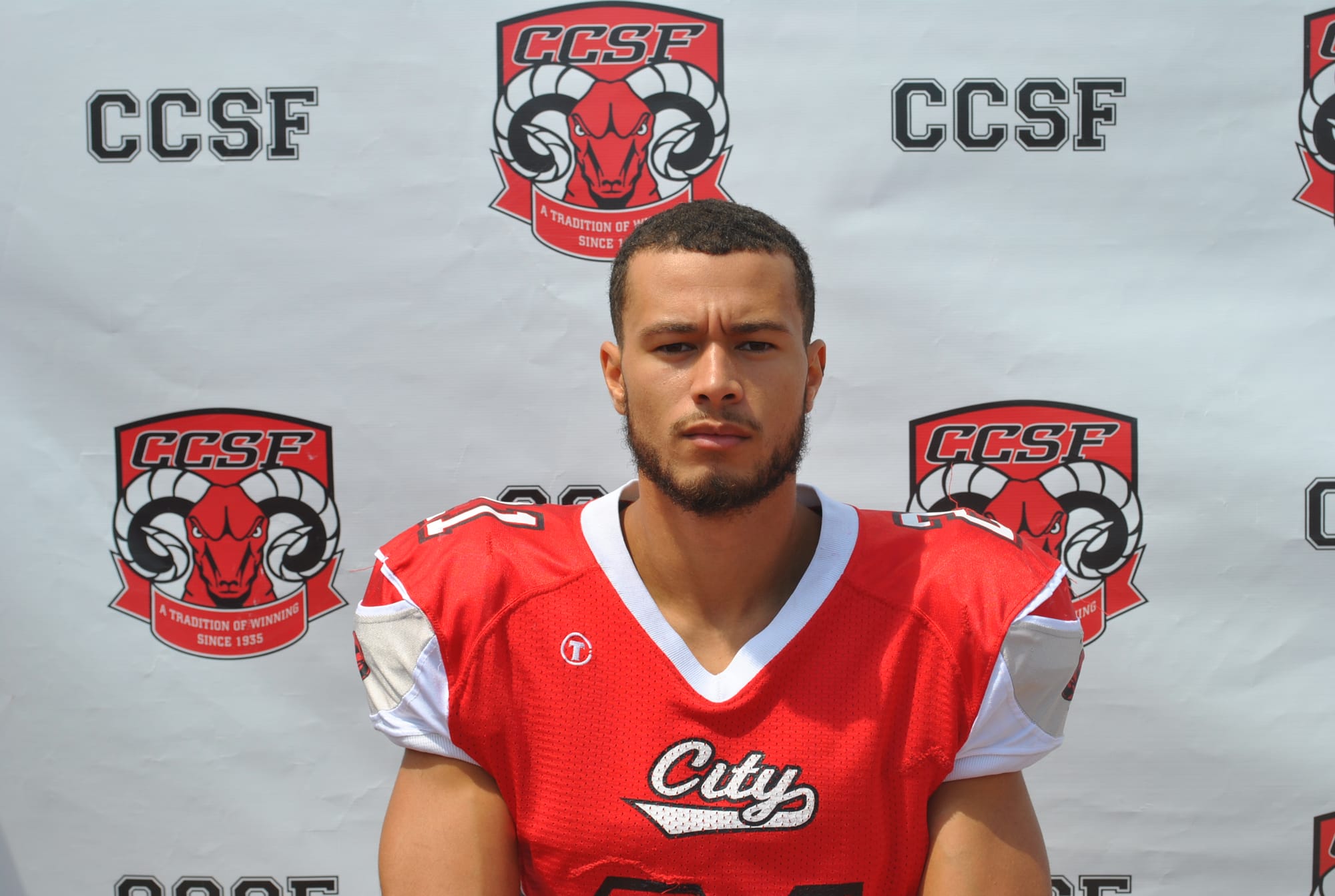 Defensive Back Terin Adams (#21) signs with Arizona State. Photo courtesy of CCSF Athletics Department. 