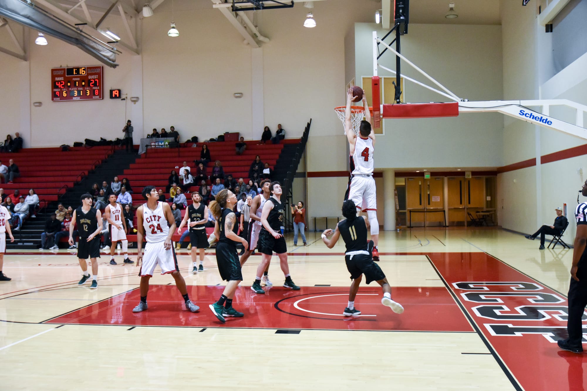 City College Ram's sophomore guard Eddy Ionescu (#4) receives lob pass from sophomore guard Eddie Stansberry (#11) for the two-hand jam against Ohlone College on Feb. 16, 2018. Photo by Michael Menaster/special to The Guardsman. 