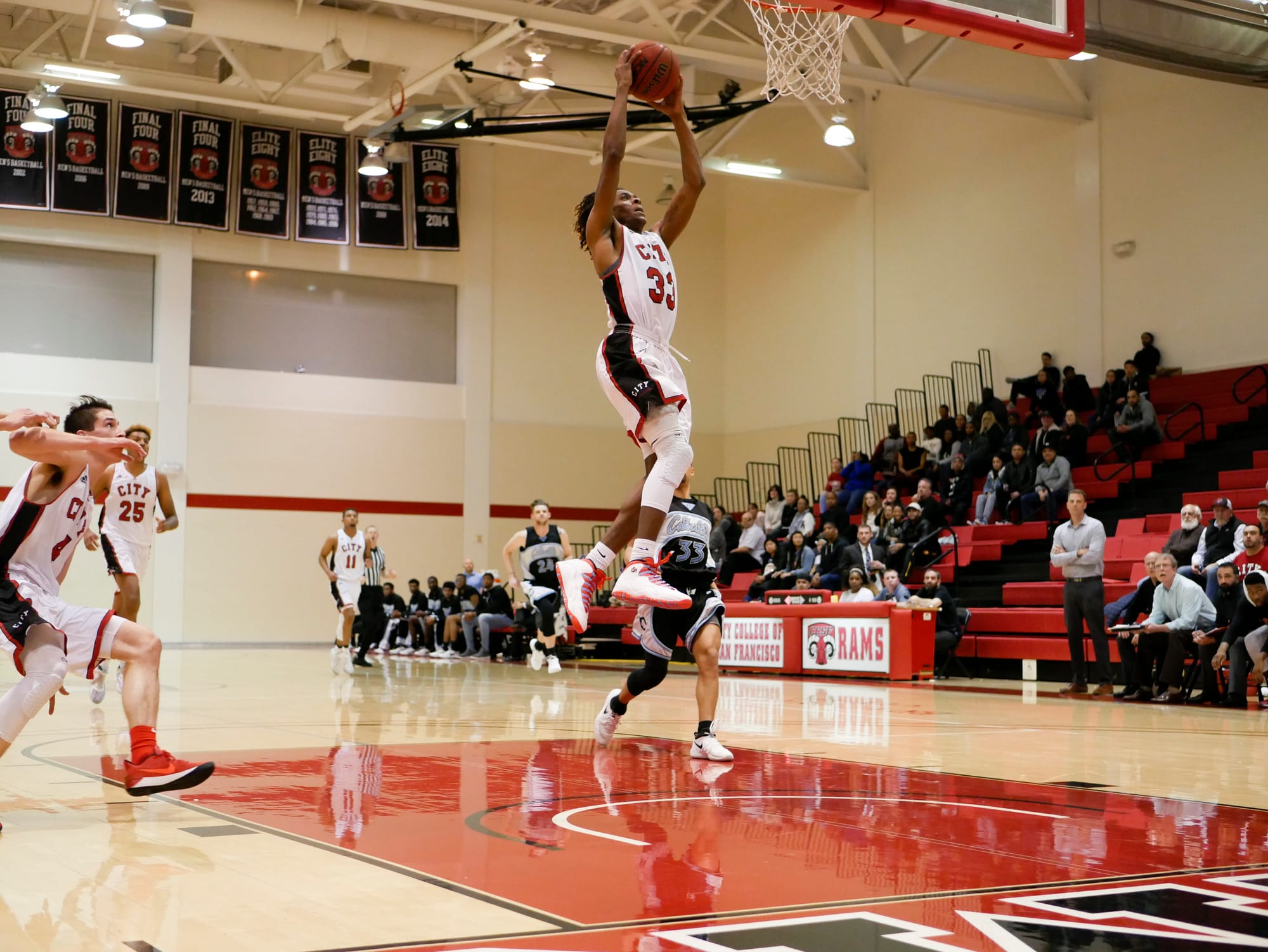 The Rams freshman guard Terrell Brown (#33) breaks free for the two-handed slam dunk during March 3, 2018 game against Cabrillo College. Photo by James Comfort/Special to The Guardsman. 