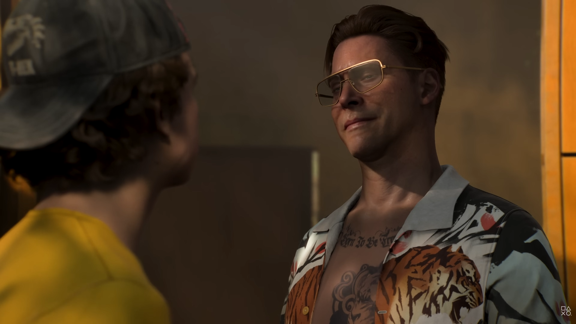 Neil Newbon portrays Sebastian, a man in fancy shades, a tiger shirt hanging open, and a heavily tattooed chest. He seems nice!