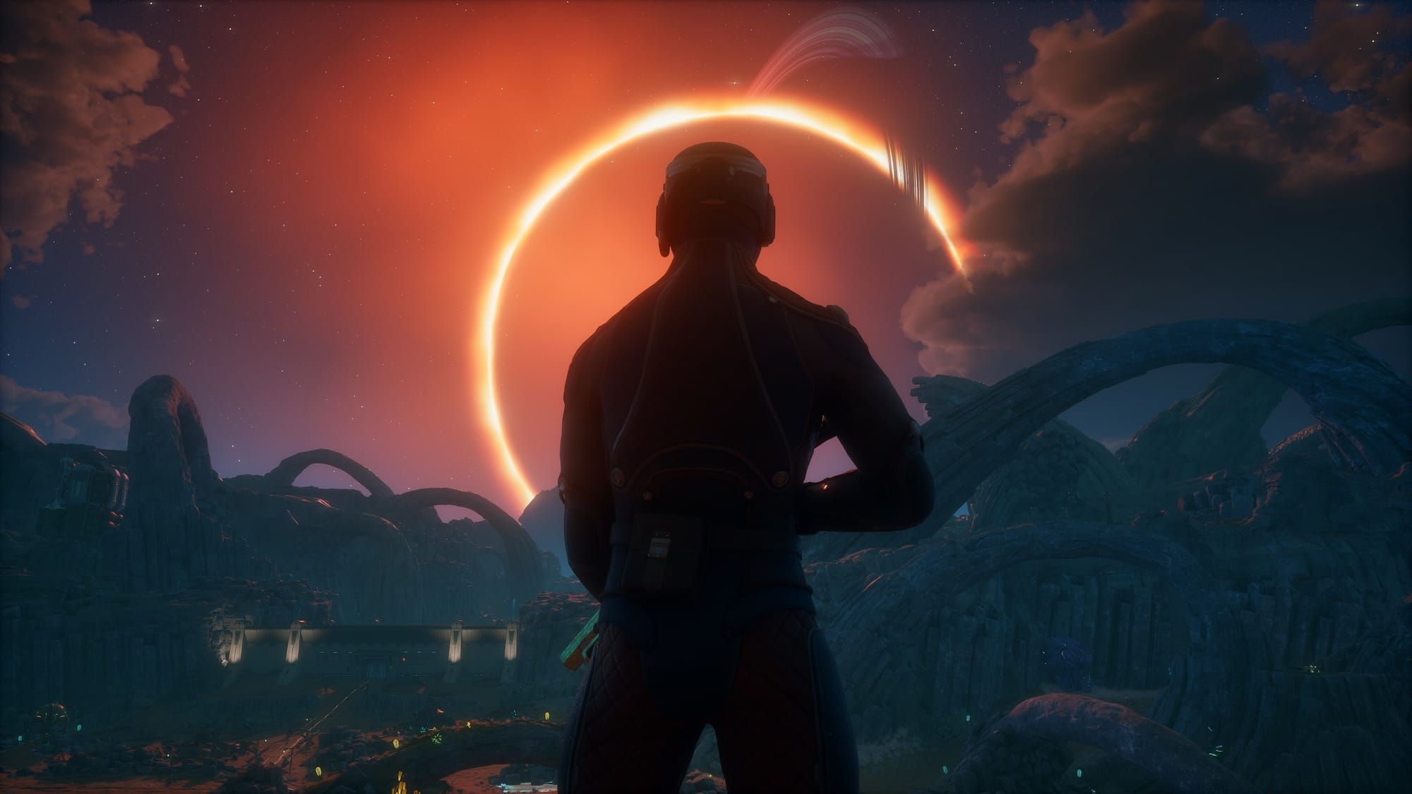 A screenshot from The Outer Worlds, depicting the protagonist from behind cloaked in shadow, standing against the illuminating circle of a space rift.