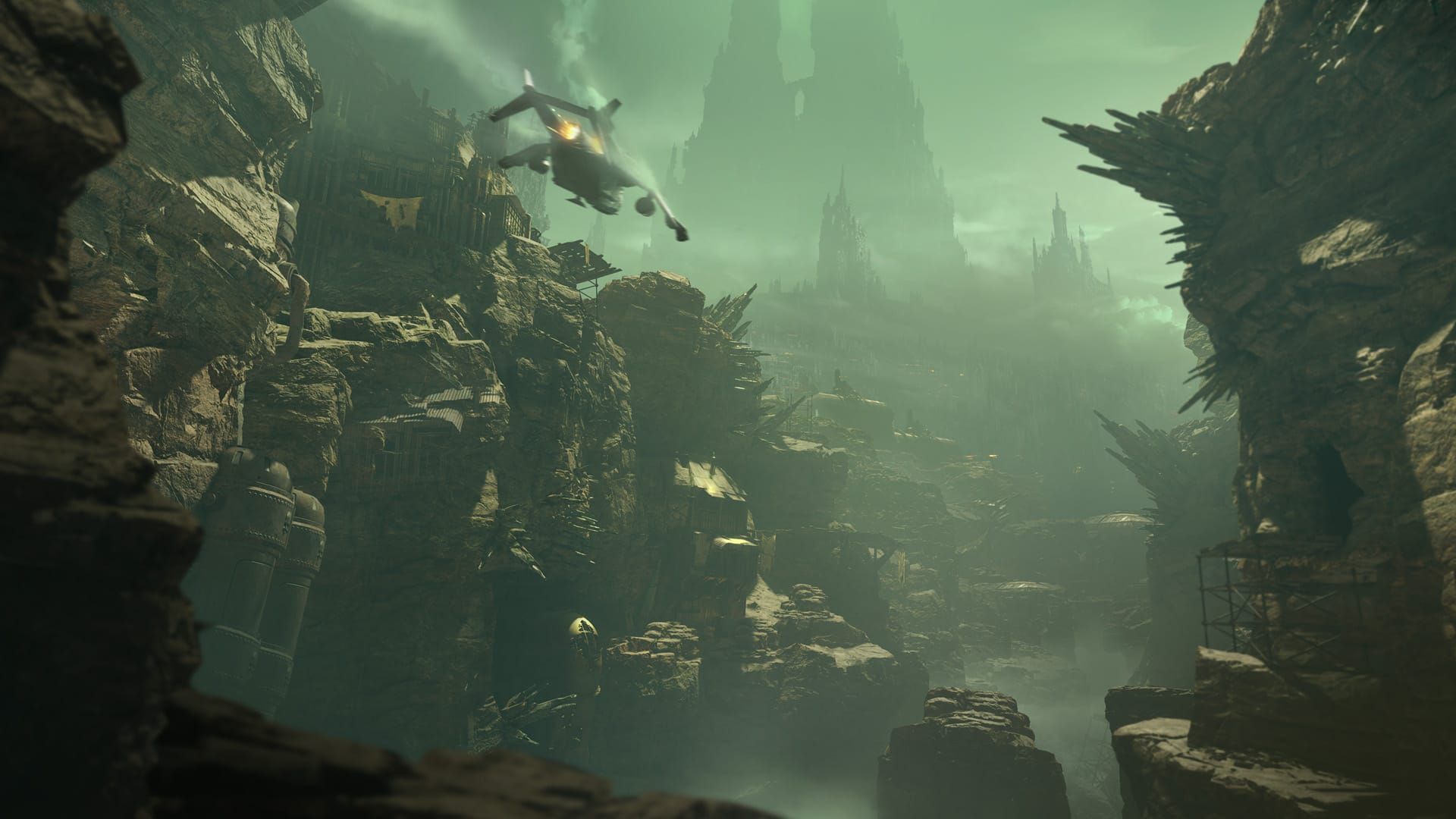 A Valkyrie airship flies through rocky and craggy scenery outside the Hive City of Tertium in a screenshot from the Darktide update Beyond the Hive