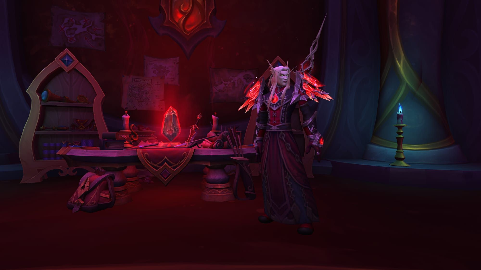 Astalor Bloodsworn, a blood elf in dramatic red armor, stands at the Prey mission table, which has an ominous red crystal hovering over it.