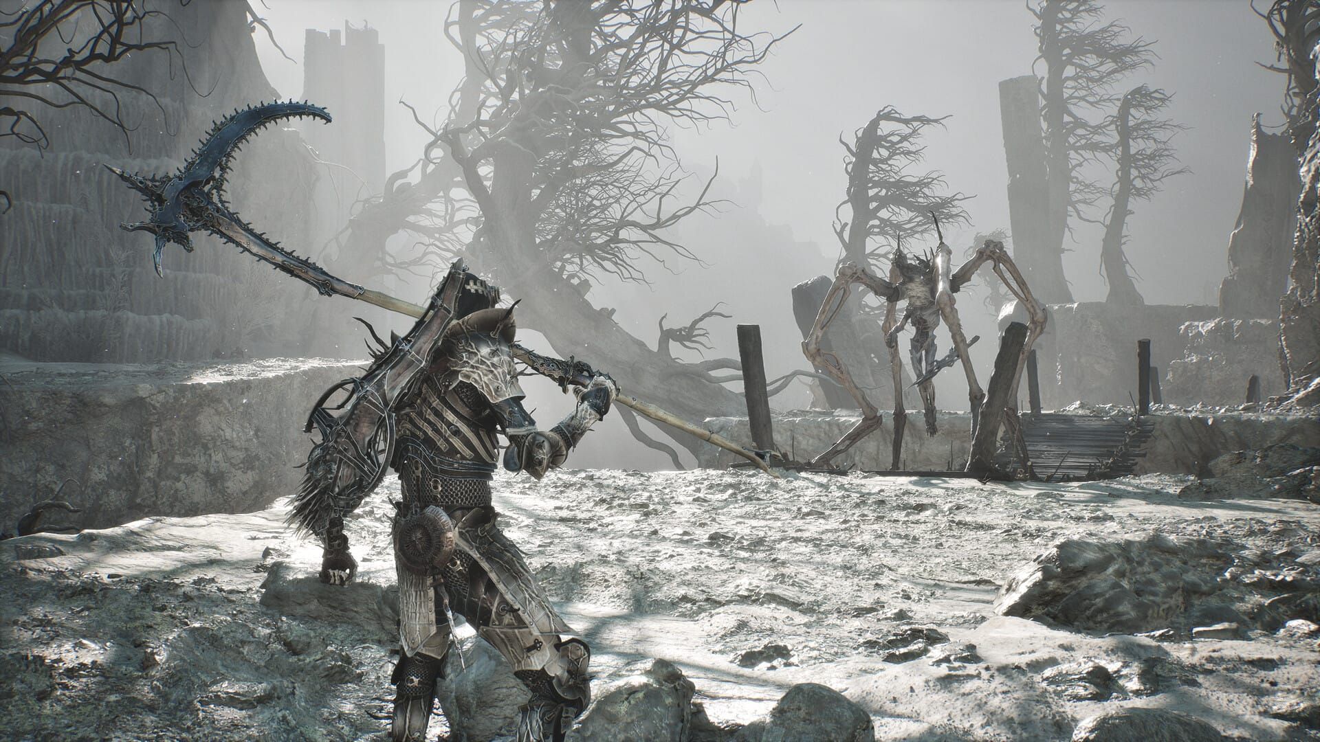 The player wielding a giant scythe in the snow looking at a monstrous spider