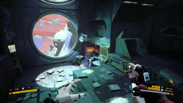 A sci-fi environment left abandoned, with books and personal materials scattered on the floor. The scene is lit by a circular window through which we can see a pink sky and strange land masse