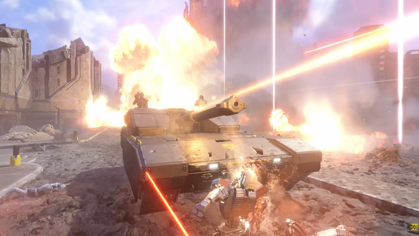 Helldivers drive through a city street in their tank, mowing down Automaton soldiers while firing into the distance.