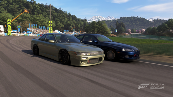 A screenshot of two cars racing on a dedicated race track