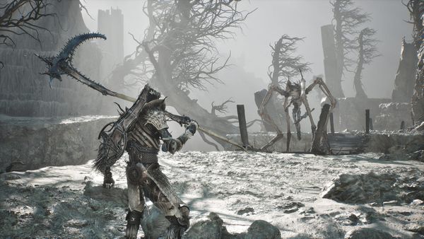 The player wielding a giant scythe in the snow looking at a monstrous spider