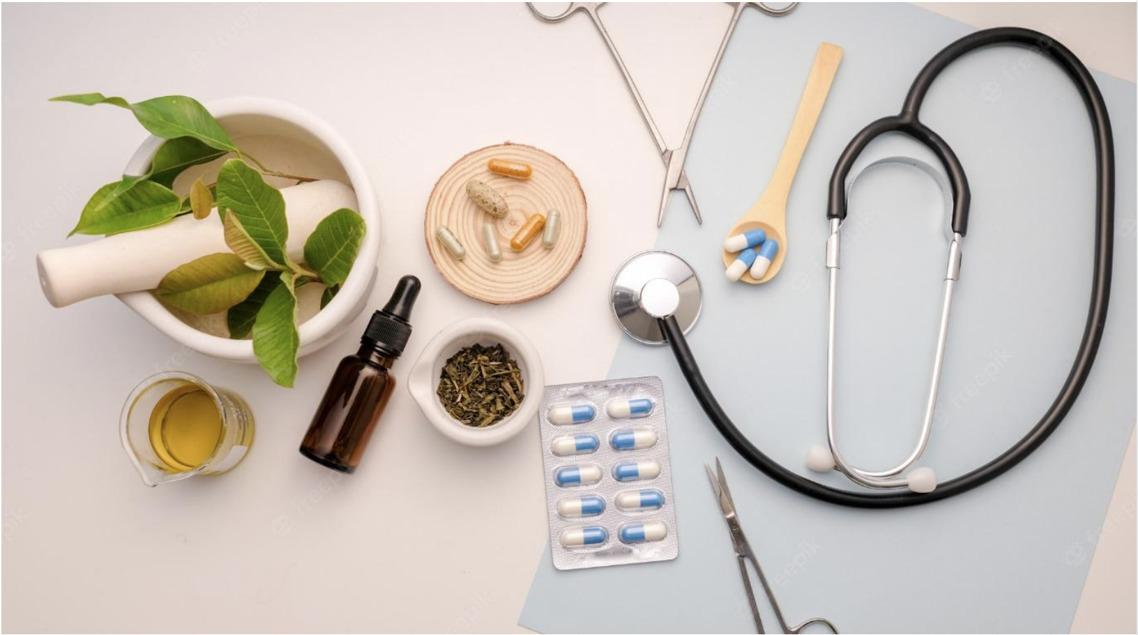 A stethoscope and pills on a table

Description automatically generated