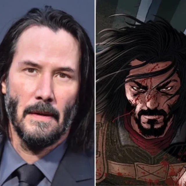 A photo of Keanu Reeves looking serious at a red carpet event. His hair is shoulder length and he has a moustache and beard.