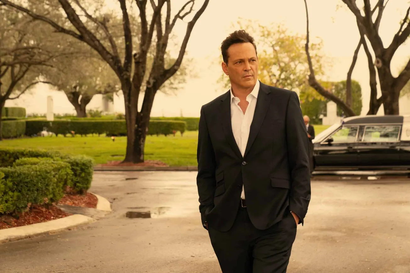 a still of Vince Vaughn as his character Andrew Yancy in 'Bad Monkey'. He's wearing a suit and has his hands in his pockets a