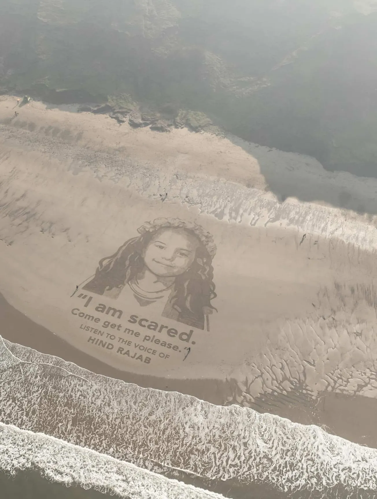A sand portrait of Hind Rajab in Yorkshire, England