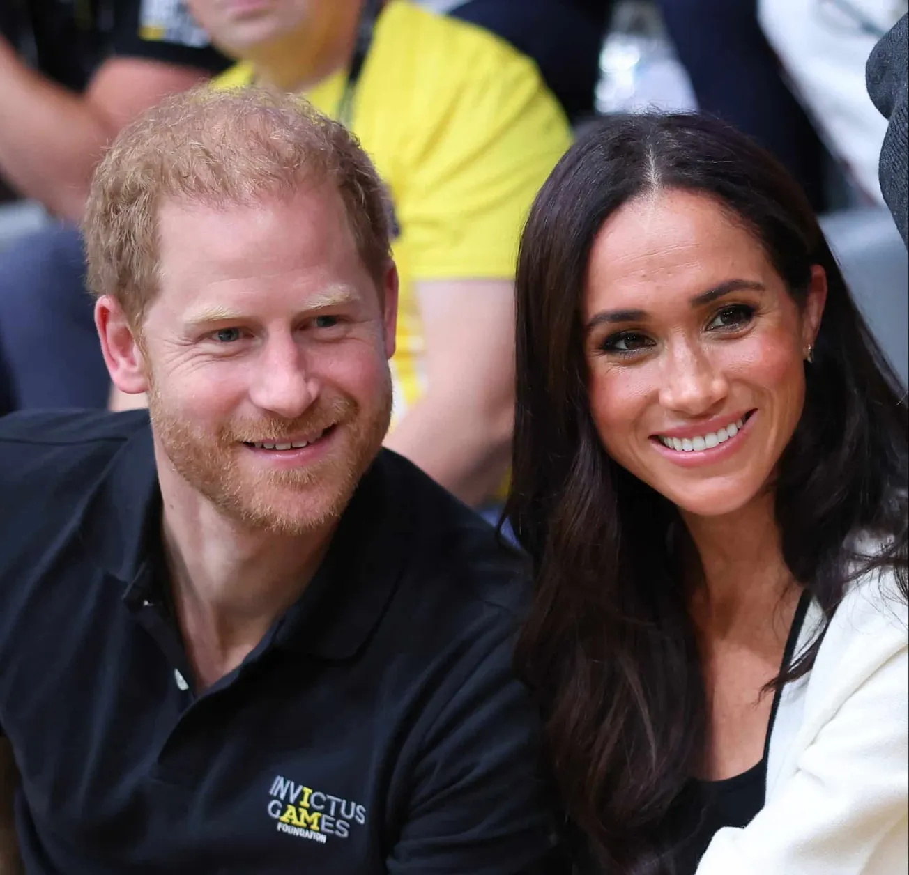Harry and Meghan smile together at the 2023 Invictus Games.