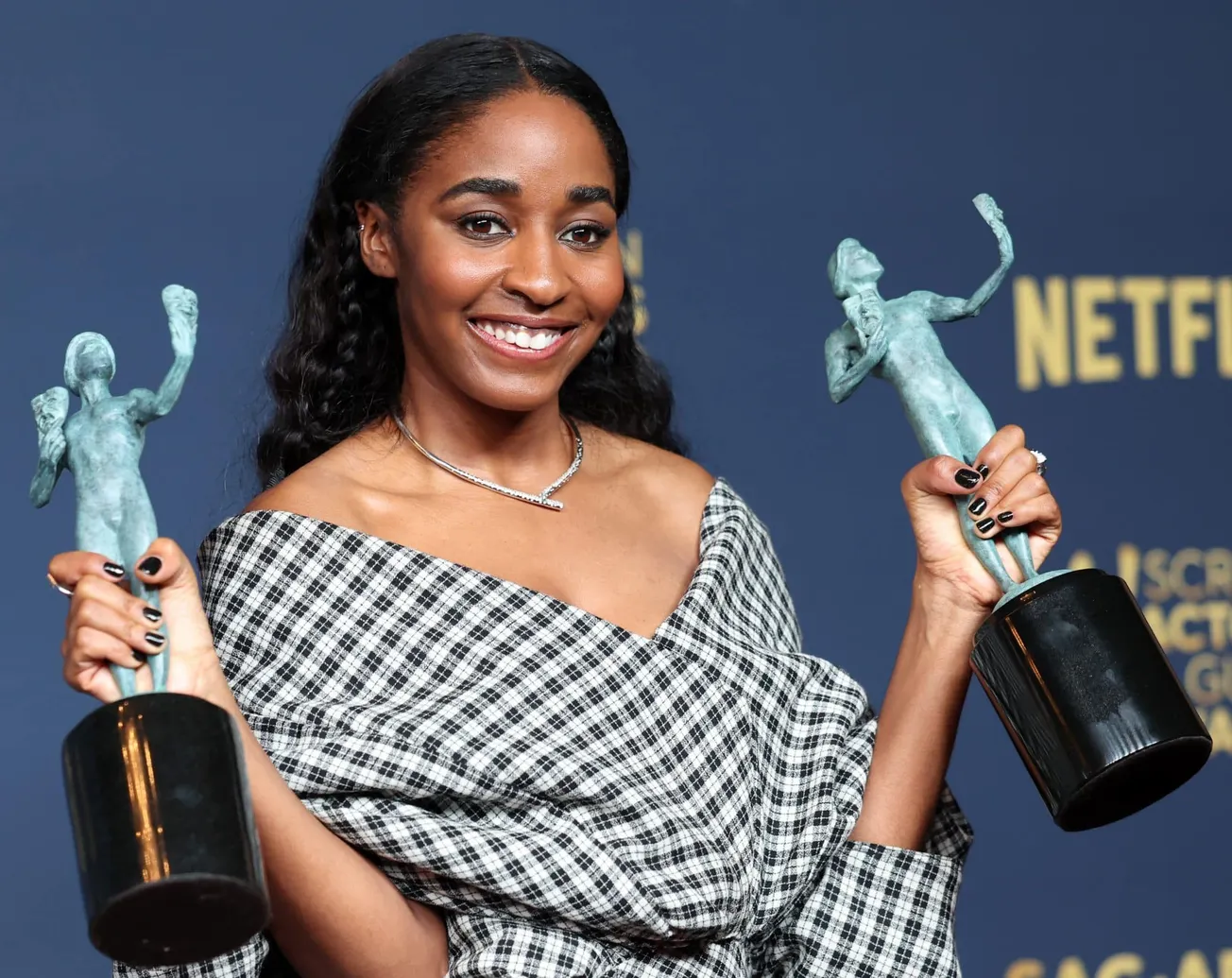 Ayo Edibiri holding two of her awards at the SAG Awards 2024,